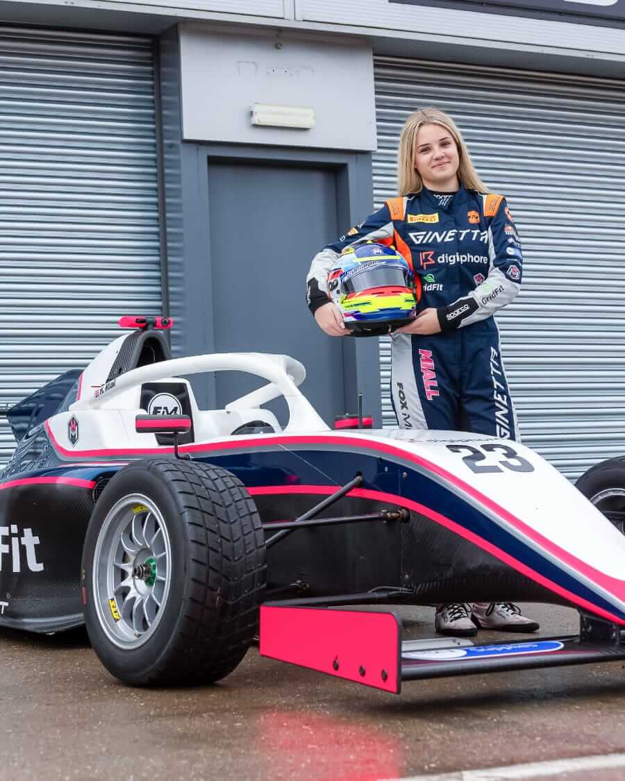 Holly alongside her 2025 ride in the GB4 Championship